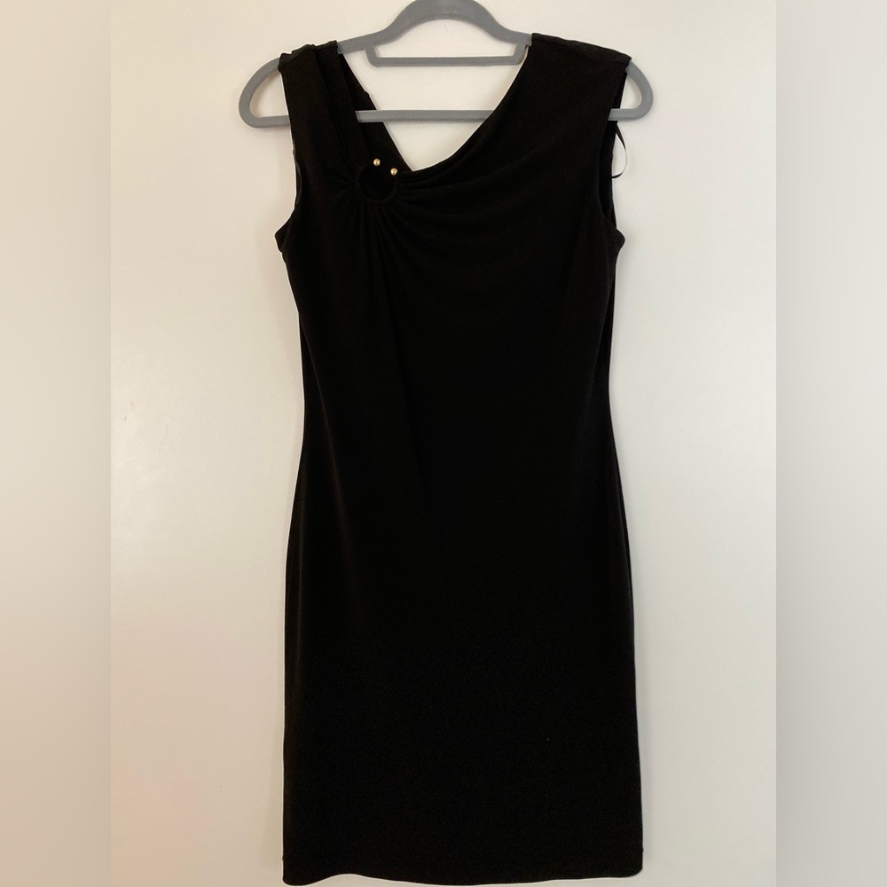 Calvin Klein Black dress with golden accessory on the right top